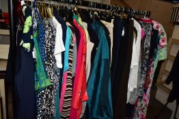 A QUANTITY OF LADIES CLOTHING, to include dresses, blouses, jackets and coats, etc, sizes from 10 to