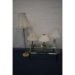 A BRASS FRAMED BEVELLED EDGE GLASS TOP COFFEE TABLE, sat on sphere finials to each square tapered