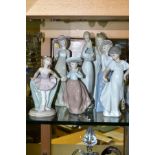 SEVEN NAO FIGURES OF GIRLS, ONE BOXED, includes a ballet dancer, girl yawning, height 28cm, young