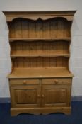 A PINE DRESSER, with two short drawers above two cupboard doors, width 122cm x depth 44cm x height