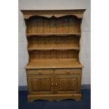 A PINE DRESSER, with two short drawers above two cupboard doors, width 122cm x depth 44cm x height