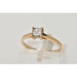 A SINGLE STONE DIAMOND RING, yellow metal ring , designed with a four claw set, princess cut
