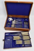 A CANTEEN OF CUTLERY, oak canteen opens to reveal a complete set of forty-eight piece set of EP