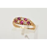 AN EARLY 20TH CENTURY 18CT GOLD RUBY AND DIAMOND BOAT RING, the ring head of an oval form, set