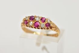 AN EARLY 20TH CENTURY 18CT GOLD RUBY AND DIAMOND BOAT RING, the ring head of an oval form, set