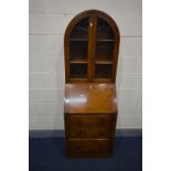 AN OAK ART DECO BUREAU BOOKCASE, the arched bookcase top with double glazed doors enclosing two