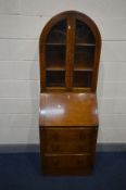 AN OAK ART DECO BUREAU BOOKCASE, the arched bookcase top with double glazed doors enclosing two