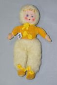 A CLOTH FACED DOLL, painted features, yellow velvet top and shoes, white furry hat and trousers,