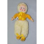 A CLOTH FACED DOLL, painted features, yellow velvet top and shoes, white furry hat and trousers,