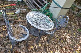 A CAST ALUMINIUM GARDEN TABLE with 58cm pierced top and a pair of matching chairs (3)