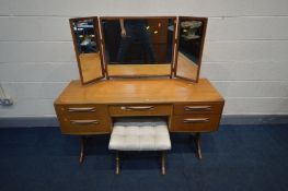 A G-PLAN TEAK DRESSING TABLE, with triple dressing mirror, central drawer with purple baize