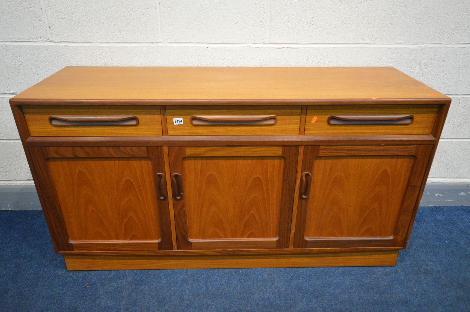 A G PLAN FRESCO TEAK SIDEBOARD, with three drawers above triple cupboard doors, width 143cm x