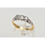 A MID TO LATE 20TH CENTURY THREESTONE DIAMOND RING. Three round brilliant cut diamonds claw set to