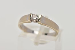A SINGLE STONE DIAMOND RING, white metal ring, tension set round brilliant cut diamond,