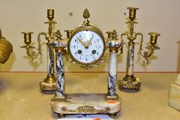 A LATE 19TH CENTURY GILT METAL AND MARBLE CLOCK GARNITURE, the clock with gilt metal cone finial and