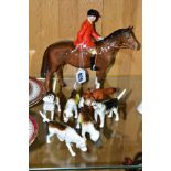 A BESWICK HUNTSMAN, FOX AND FIVE FOXHOUNDS, the Huntsman, style two standing, brown gloss model
