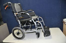 A KARMA ERGO LITE 2 FOLDING WHEELCHAIR with footrests