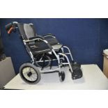 A KARMA ERGO LITE 2 FOLDING WHEELCHAIR with footrests