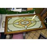 AN EDWARDIAN MAHOGANY FRAMED TWIN HANDLED RECTANGULAR TRAY, the glass top enclosing a Neo-