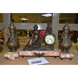 AN EARLY TWENTIETH CENTURY BRONZED SPELTER AND MARBLE CLOCK GARNITURE, the figural clock with