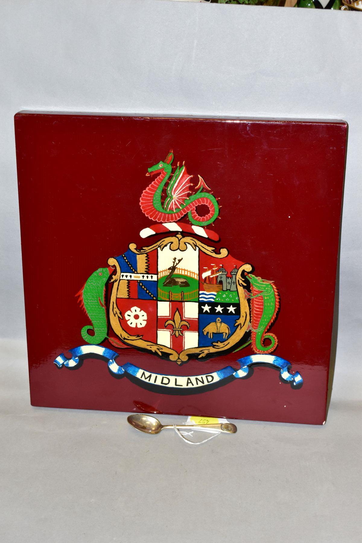 A WOODEN WALL PLAQUE THE CREST OF THE MIDLAND RAILWAY, size 30.5cm square, together with an EPNS