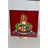 A WOODEN WALL PLAQUE THE CREST OF THE MIDLAND RAILWAY, size 30.5cm square, together with an EPNS