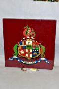 A WOODEN WALL PLAQUE THE CREST OF THE MIDLAND RAILWAY, size 30.5cm square, together with an EPNS