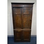 A LATE 19TH/EARLY 20TH CENTURY OAK OFFICE CABINET, the panelled sliding doors enclosing an