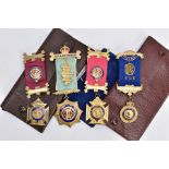 FOUR SILVER MASONIC FOB MEDALS, four gilt and enamelled fob medals, each fitted with their ribbons