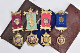 FOUR SILVER MASONIC FOB MEDALS, four gilt and enamelled fob medals, each fitted with their ribbons