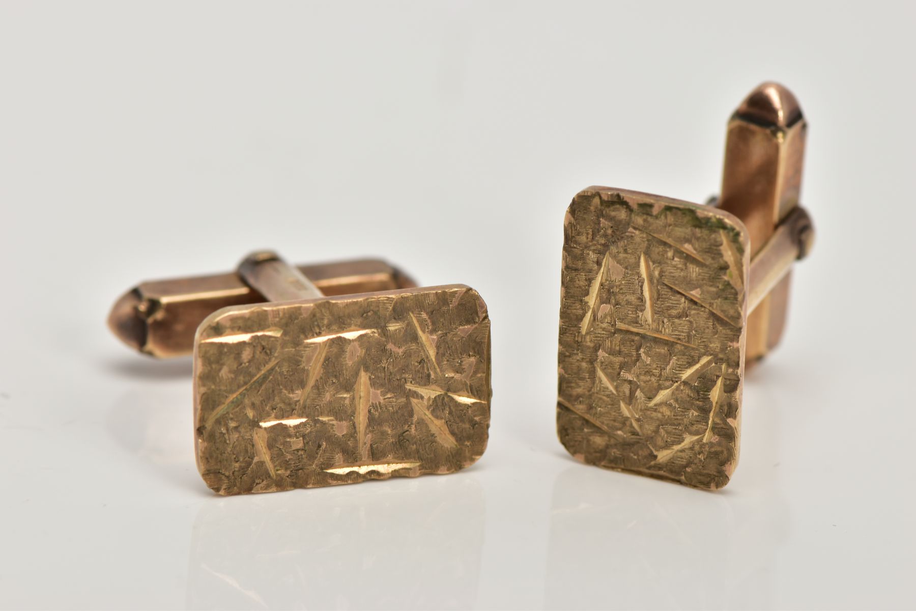 A PAIR OF 9CT GOLD CUFFLINKS, each of a rectangular textured design, hallmarked 9ct gold