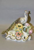 A BOXED ROYAL CROWN DERBY PEACOCK (LOW), modelled as perching on a florally encrusted branch, gilt