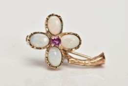 A 9CT GOLD OPAL AND RUBY FLOWER BROOCH, designed with four oval opal cabochon petals and a central