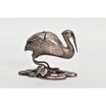 A CHINESE SILVER STORK PEPPERETTE, in the form of a stork with hinged lid to the back section,