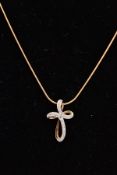 A 9CT GOLD DIAMOND PENDANT NECKLACE, the pendant in the form of an openwork cross, set with single