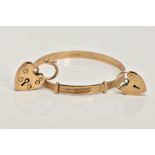 A 9CT GOLD CHILDS BANGLE AND TWO HEART SHAPED CLASPS, the child's bangle with a textured design,