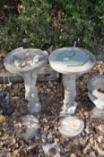 A COMPOSITE SUNDIAL AND A DISTRESSED BIRD BATH with similar Cherub columns and round bases both 70cm