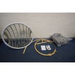 A NEARLY NEW RATTAN SINGLE HANGING EGG CHAIR on a circular metal base, width of chair 105cm, with