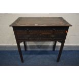 A LATE 19TH CENTURY CARVED OAK SIDE TABLE, with a long drawer above two short drawers, on block