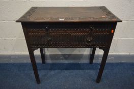 A LATE 19TH CENTURY CARVED OAK SIDE TABLE, with a long drawer above two short drawers, on block