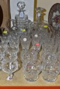 THIRTY FOUR PIECES OF CUT GLASS, including two decanters and stoppers, two water jugs and assorted