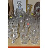 THIRTY FOUR PIECES OF CUT GLASS, including two decanters and stoppers, two water jugs and assorted