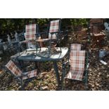 A GREEN PLASTIC GARDEN TABLE 135cm wide, along with five folding chairs (6)