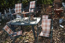 A GREEN PLASTIC GARDEN TABLE 135cm wide, along with five folding chairs (6)