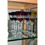 A HARLEQUIN SET OF SIX FLASH CUT WINE GLASSES, clear stem and foot, height 22cm (6)