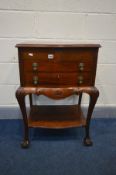 AN VICTORIAN STYLE MAHOGANY SERPENTINE CUTLERY CABINET, the hinged top enclosing a later red