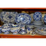 A LATE 19TH CENTURY/EARLY 20TH CENTURY BLUE AND WHITE DINNER SERVICE IN THE DELFT PATTERN BY