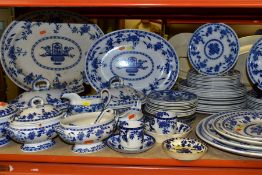 A LATE 19TH CENTURY/EARLY 20TH CENTURY BLUE AND WHITE DINNER SERVICE IN THE DELFT PATTERN BY