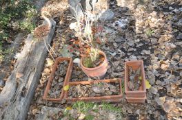 TWO PAIRS OF RECTANGULAR TERRACOTTA PLANTERS 49cm and 32cm wide, a round planter, a cast iron