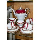 AN AYNSLEY TWENTY ONE PIECE COFFEE SET, Claret and gilt decoration, comprising coffee pot and cover,